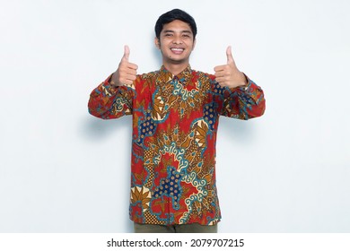 asian man wearing batik with ok sign gesture tumb up isolated on white background