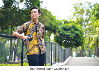 Asian Man Wearing Batik Pattern Indonesia Shirt Smiling