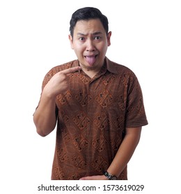 Asian Man Wearing Batik Shirt Shows His Tongue, Sick Person Sticking Tongue Out