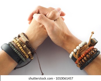 Asian Man Wearing A Bracelet Made Of Rope, Wood, Stone, Leather, Wood, Beads And Rope Sack Wrist On Both Sides,hipster,fashion On White Background.Collaboration Tools Demonstrate Confidence.