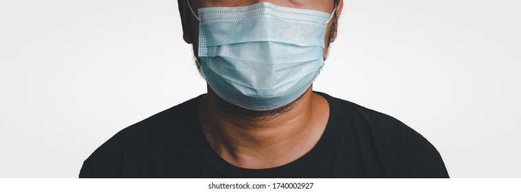 Asian man wearing face protective mask against  to prevent the spread of the corona virus. - Shutterstock ID 1740002927