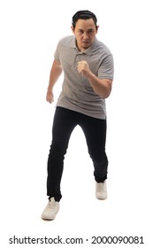 Asian Man Wearing Grey Shirt Black Denim And White Shoes, Looking At Camera Seriously, Ready To Run, Front View. Full Body Portrait Isolated Cut Out