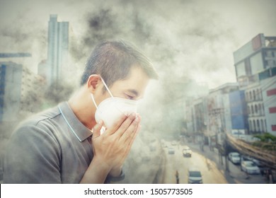 Asian Man Wearing The N95 Respiratory Protection Mask Against Air Pollution At Road And Traffic In Bangkok