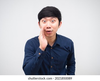 Asian Man Whisper At You Hand Up At His Mouth Portrait White Background