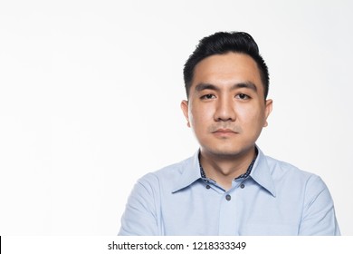 Asian Man In Work Attire With Serious Face