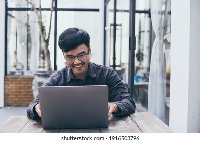 asian man work using computer hand typing laptop keyboard contact us.student study learning education online.adult professional people chatting search at office.concept for technology device business