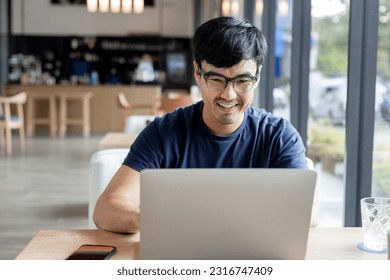 asian man work using computer hand typing laptop keyboard contact us.student study learning education online.adult professional people chatting search at office.concept for technology device business