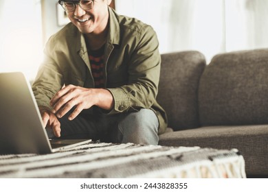 asian man work using computer hand typing laptop keyboard contact us.student study learning education online.adult professional people chatting search at office.concept for technology device business