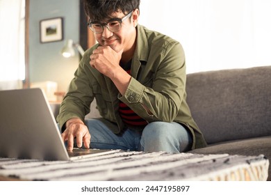 asian man work using computer hand typing laptop keyboard contact us.student study learning education online.adult professional people chatting search at office.concept for technology device business