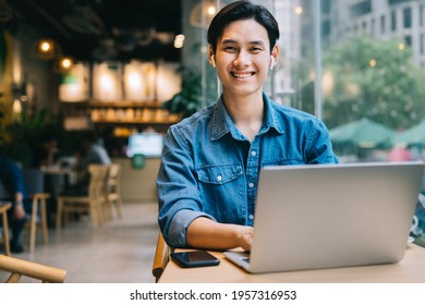 Asian man working at cafe on weekend
 - Shutterstock ID 1957316953