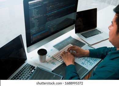 Asian Man Working Code Program Developer Computer Web Development Working Design Software On Desk In Office.