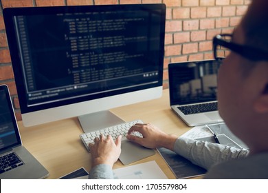 Asian Man Working Code Program Developer Computer Web Development Working Design Software On Desk In Office.