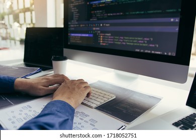 Asian Man Working Code Program Developer Computer Web Development Working Design Software On Desk In Office.