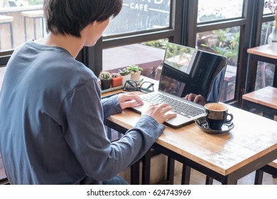 Asian Man Working In A Coffeeshop