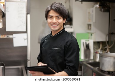 Asian man working in a restaurant