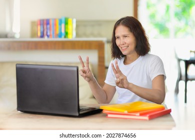 Asian Mathematic Teacher Teaching Online.Math Tutor Online Class Using Laptop.Person Remote Schooling.Female Homeschooling In Asia During Pandemic.Education E-learning.Woman Distance Learning.