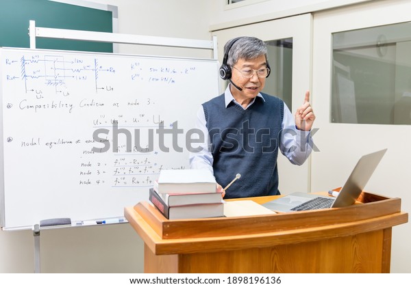 Asian Mature Male Professor Wearing Headset Stock Photo (Edit Now ...