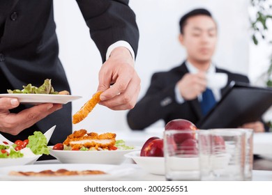 Asian Men During Business Lunch In The Office