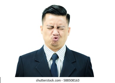 Asian Men Are Exercising Facial Muscles, Pucker Up And Eyes Closed