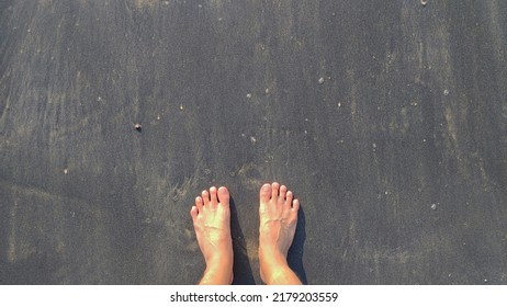 Asian Men Foot On Black Sand Beach At Nang Thong Beach At Khao Lak Phang Nga Thailand - Black Nature Abstract Background 