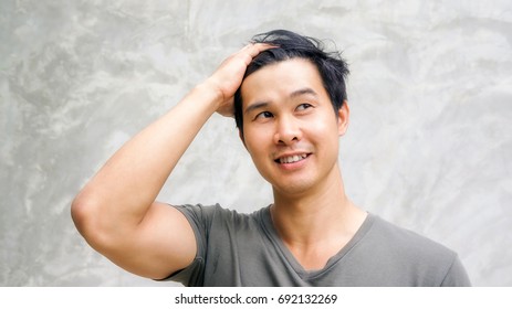 Asian Men Slick His Hair Back.