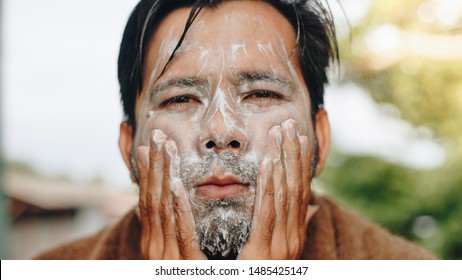 Asian Men Are Washing Their Face With Foam , Men Skin Care Concept