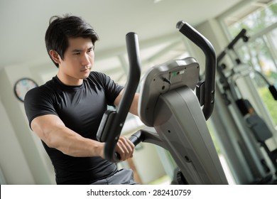 Asian Men Were Cycling In The Gym. He Has A Strain Rate Of The Heart Rate