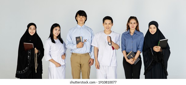 Asian men   women different religions have Buddhism  Muslims  Christ bible Quran  A smiling face wearing religious clothes  white background  Concept religions exchange teachings and one another