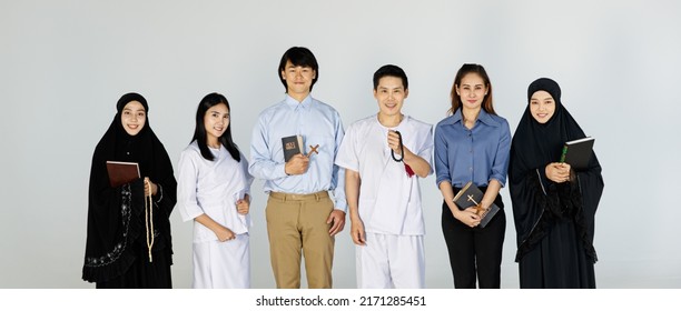 Asian men and women of different religions have Buddhism, Muslims, Christ. bible Quran. A smiling face wearing religious clothes on, white background. Concept religions exchange teachings  - Shutterstock ID 2171285451