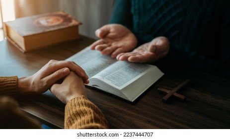 Asian men and women hands praying to god with the bible. Pray for god blessing. Religious beliefs Christian life crisis prayer to god. - Shutterstock ID 2237444707