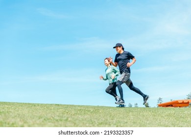 Asian Men And Women Running And Aerobic Exercise