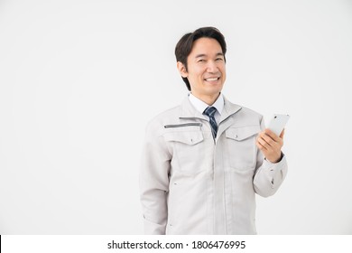 Asian middle age construction Worker ,smart phone,