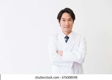 Asian Middle Age Man In A White Coat