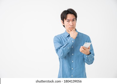 Asian Middle Age Man Who Uses Smart Phone,think,