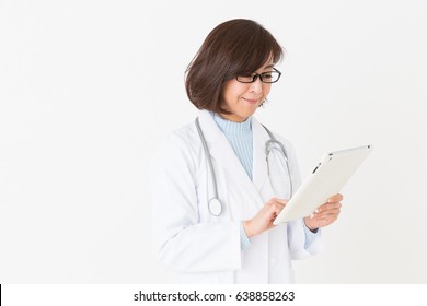 Asian Middle Age Woman In A White Coat