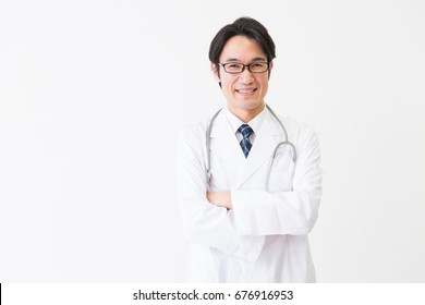 Asian Middle Age Woman In A White Coat,