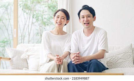 Asian middle aged couple in the room. - Powered by Shutterstock