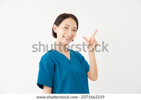 Asian middle aged doctor check mark gesture in white background
