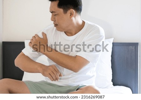 Asian middle aged man suffering from pain in shoulder,Subscapularis tendinitis,Rotator cuff tear or degeneration,tired male patient with shoulder osteoarthritis or rheumatoid arthritis,health problems