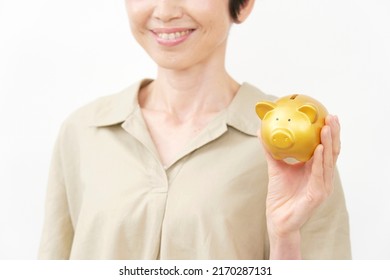 Asian Middle Aged Woman Having The Piggy Bank In White Background, No Face