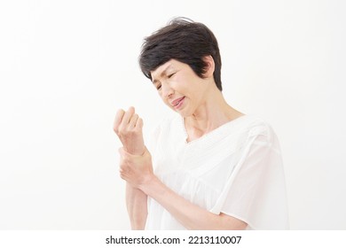 Asian Middle Aged Woman In White Background