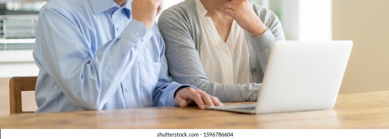 Asian Middle-aged Couple In The Living Room