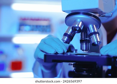 Asian middle-aged male scientist conducts research in a laboratory, surrounded by petri dishes and beakers. Investigate the chemistry of gasoline, food ingredients, perfumes, viruses, and medicine - Powered by Shutterstock