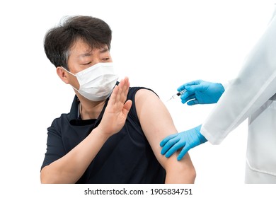 Asian Middle-aged Man Wearing Medical Mask Refusing To Inject The Vaccine.