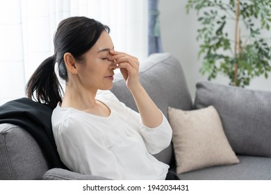 Asian Middle-aged Woman Who Is Sick