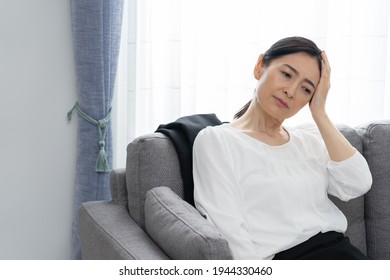 Asian Middle-aged Woman Who Is Sick