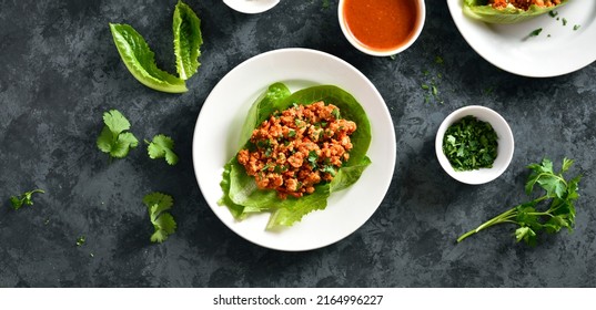 Asian Minced Meat Lettuce Wrap Over Blue Stone Background. Top View, Flat Lay