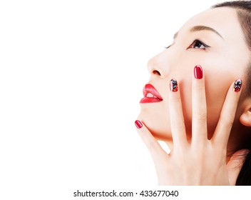 Asian Model With Red Nail Polish With Nail Art. Professional Nail Salon Design. Isolated On White Background With Copy Space. 