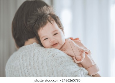 Asian mom mother holding happy baby do a burp after breastfeeding at home, Motherhood, care - Powered by Shutterstock