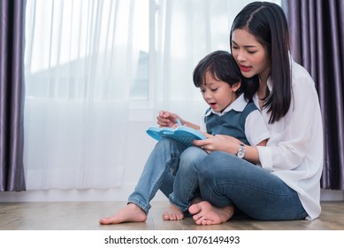 Asian Mom Teaching Cute Boy To Drawing In Chalkboard Together. Back To School And Education Concept. Family And Home Sweet Home Theme. Preschool Kids Theme.